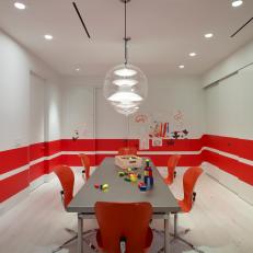 Modern Playroom Features Vibrant Red Striped Walls