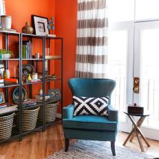 Teal Wingback Chair With Graphic Throw Pillow