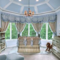 Blue Nursery With Elegant Furnishings & Crown Molding