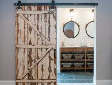 Rustic Wood Barn Door and Double Vanity Bathroom With White Tile Wall