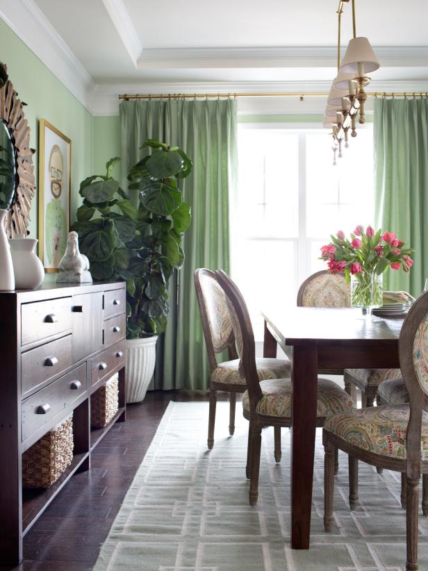 Green Dining Room With Green Curtains and Houseplant