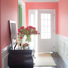 Coral Entryway With Chic Console Table and Tulips