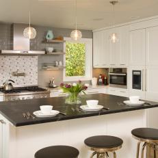 White Transitional Kitchen With Black and White Island