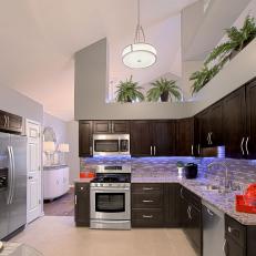 Contemporary Kitchen Features Dark Wood Cabinetry