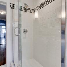 Bright White Shower Features Greek Key Tile Design