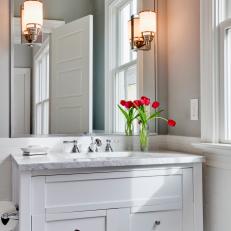 Stylish White Vanity Features Gray Marble Countertop