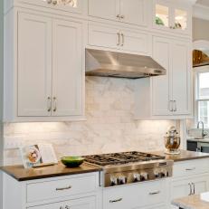 White Shaker Cabinets Pair With Marble Kitchen Backsplash