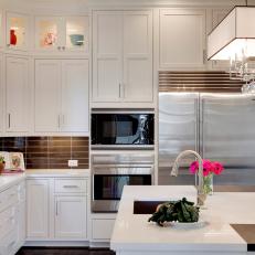 Glamorous White Kitchen With Brown Tile Backsplash