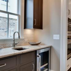 Transitional Wet Bar With Brown Cabinets