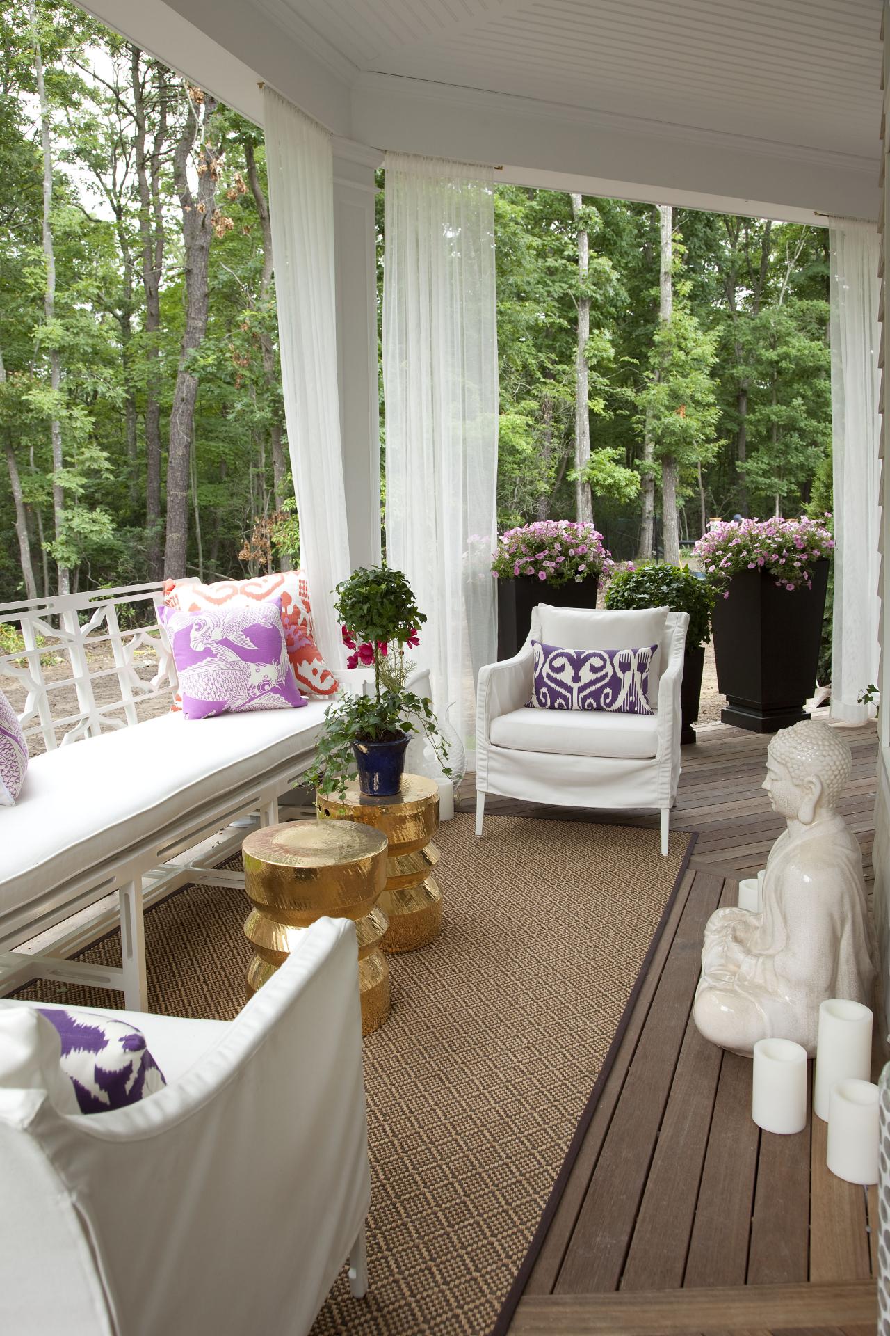 Eclectic Porch Sitting Area With White Furniture Buddha Statue Hgtv