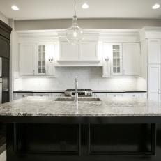 Sophisticated Gray Kitchen Features Black & White Cabinets