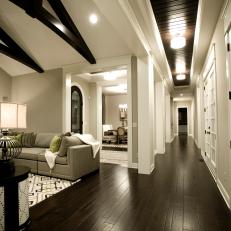 Contemporary Hallway Features Dark Hardwood Flooring
