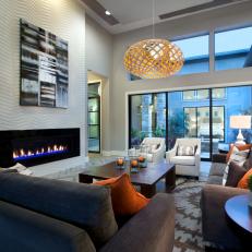 Chic Contemporary Family Room With Gray & Orange Accents