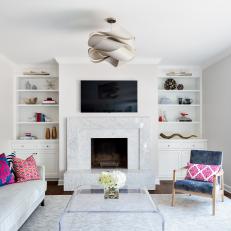 Bright Transitional Family Room With Marble Fireplace
