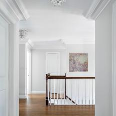 Transitional White Hallway With Elegant Lighting