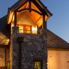 Home Exterior at Night With Stone Column