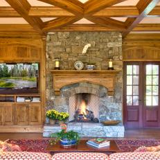 Neutral Rustic Living Room With Stone Fireplace