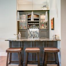 Sophisticated Bar With Leather Stools 