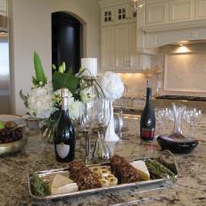 Wines and Cheeses on Kitchen Countertop