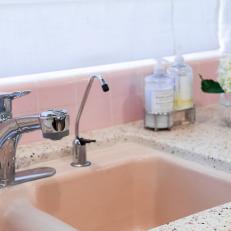 Pink Kitchen Sink With White Countertop
