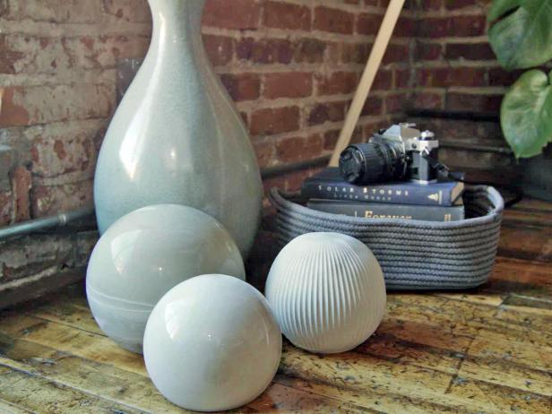 Make concrete spheres as indoor or outdoor decor with cement and old household containers.