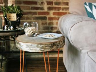 Make mixed media end tables using a round birch wood slice and plant stands.