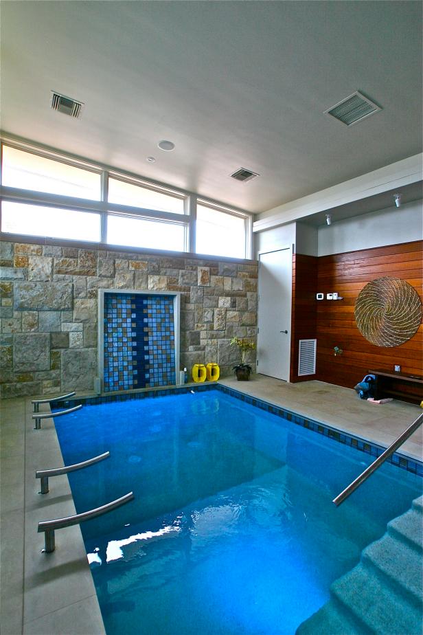 Indoor Swimming Pool With Rugged Stone Wall | HGTV