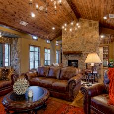 Rustic Living Room Features Brown Leather Furniture