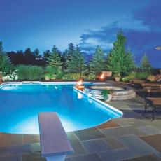 Swimming Pool at Night With Diving Board