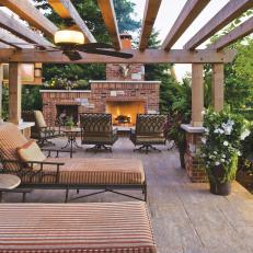 Wood Pergola With Lounge Chairs and Fireplace