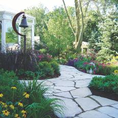 Flower Garden With Flagstone Path and Bell