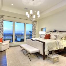 Chic Transitional Bedroom With Balcony View