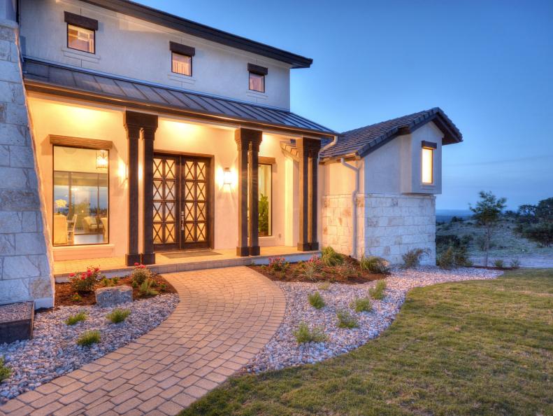 Neutral Stucco Exterior With Brown Columns & Tile Roof