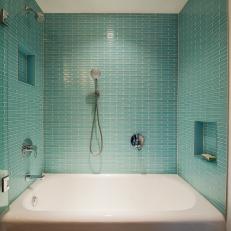 Shower and Bathtub With Blue Tile Backsplash