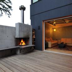 Cumaru Deck With Outdoor Concrete Fireplace & Garage Door Access to Sitting Room 