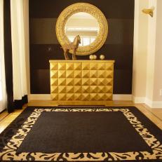Entryway With Black Walls and Gilded Accents