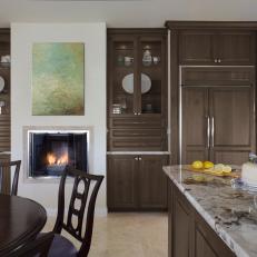 Traditional Brown Wood Kitchen Cabinets and Fireplace