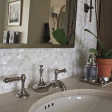 White Bathroom Vanity With Oval Tile Backsplash