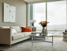 Neutral Contemporary Living Room With Orange Accents