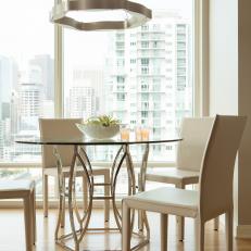 Neutral Dining Area With Glass Table