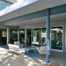 Modern Covered Patio Surrounded by Sliding Glass Doors
