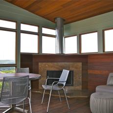 Contemporary Screened-In Porch With Rock Fireplace Surround