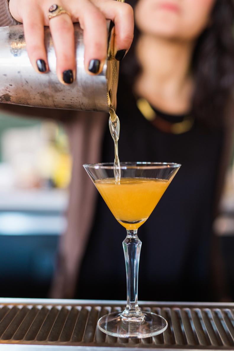 Bartender Making Drink With Cocktail Shaker