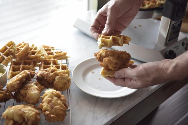 To assemble sliders, cut each waffle into four equal pieces. Spread compound butter on the inside of each waffle piece. Place a piece of fried chicken on top of a waffle and top with another waffle. Serve each guest two assembled sliders with heated maple syrup on the side.