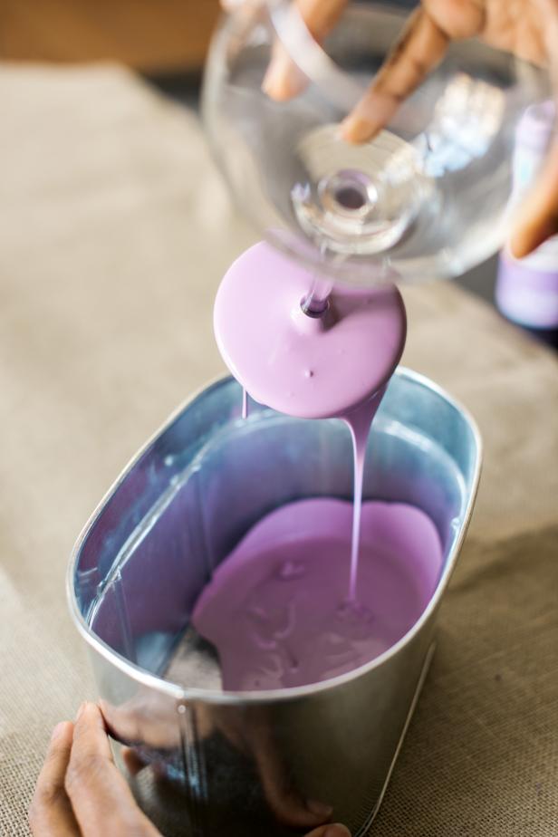 Lift glass out of the paint and hold over the bowl until the excess paint has dripped back in.