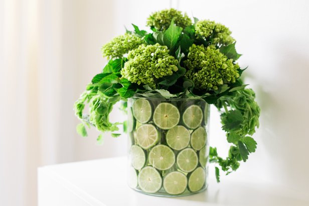 Green Flowers in Vase With Lime Slices