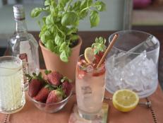 Spring Cocktail With Strawberries, Lemon & Mint Leaves