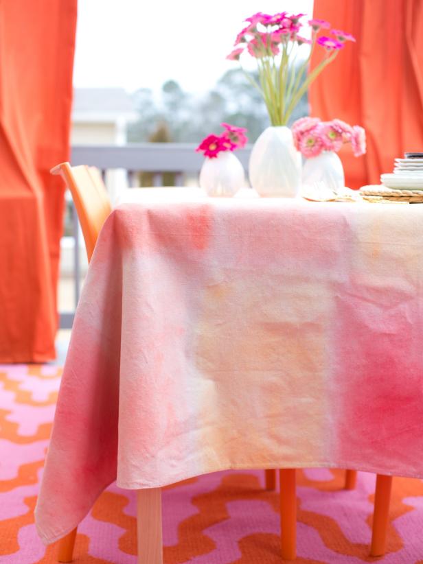 Create a stylish conversation starter for dinner or brunch guests with a tablecloth made from canvas drop cloths and water-based paint.