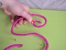 Place Letters onto Hot Glue Covered Nails and Secure 