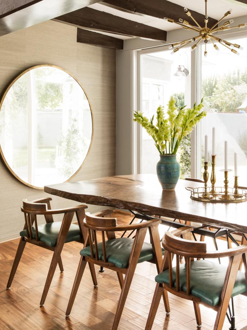 eclectic dining room with large table and mirror